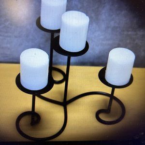 Black candle holder with white candles